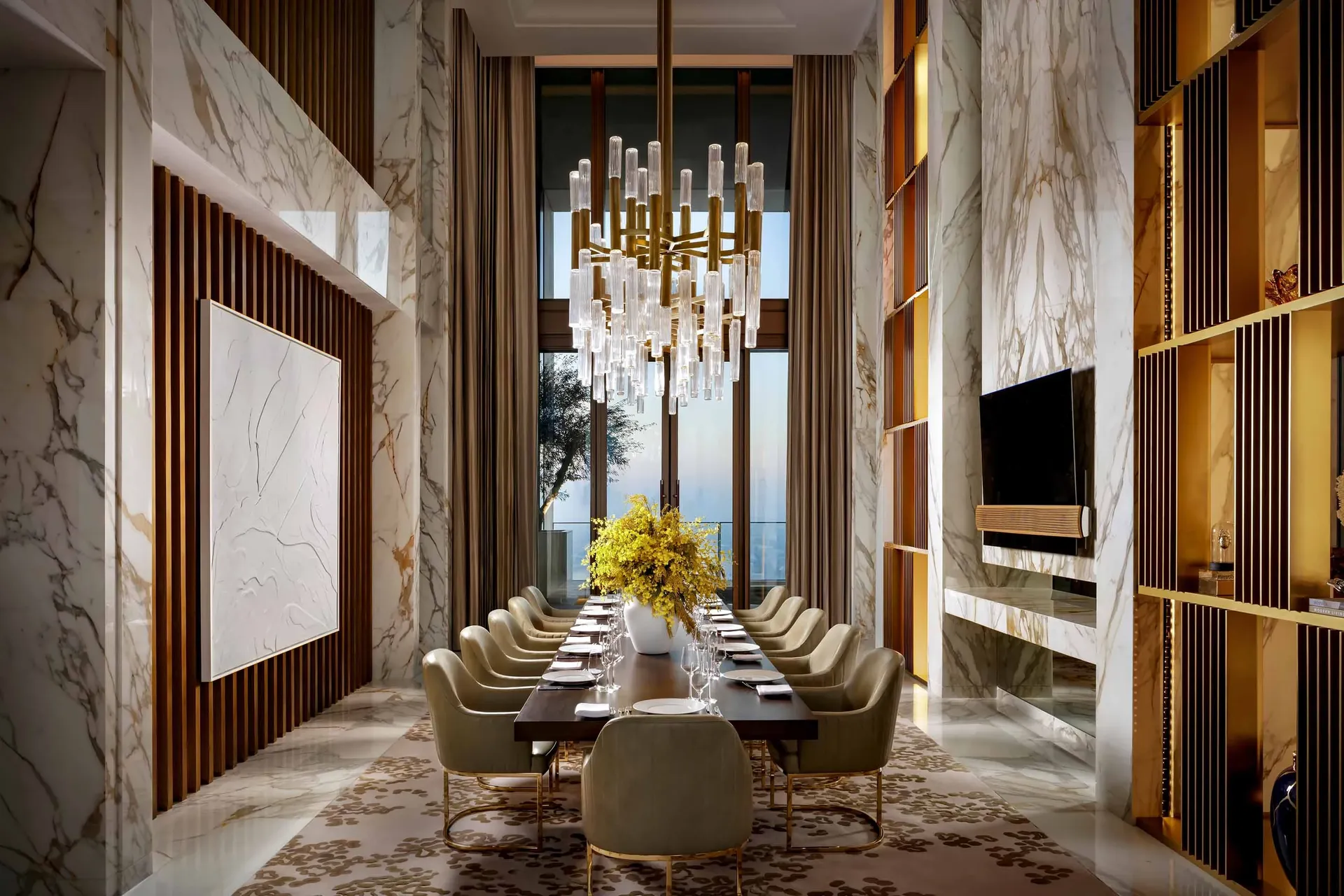 Royal Mansion at Atlantis The Royal Dubai — double-height marble dining room with crystal chandelier and skyline views