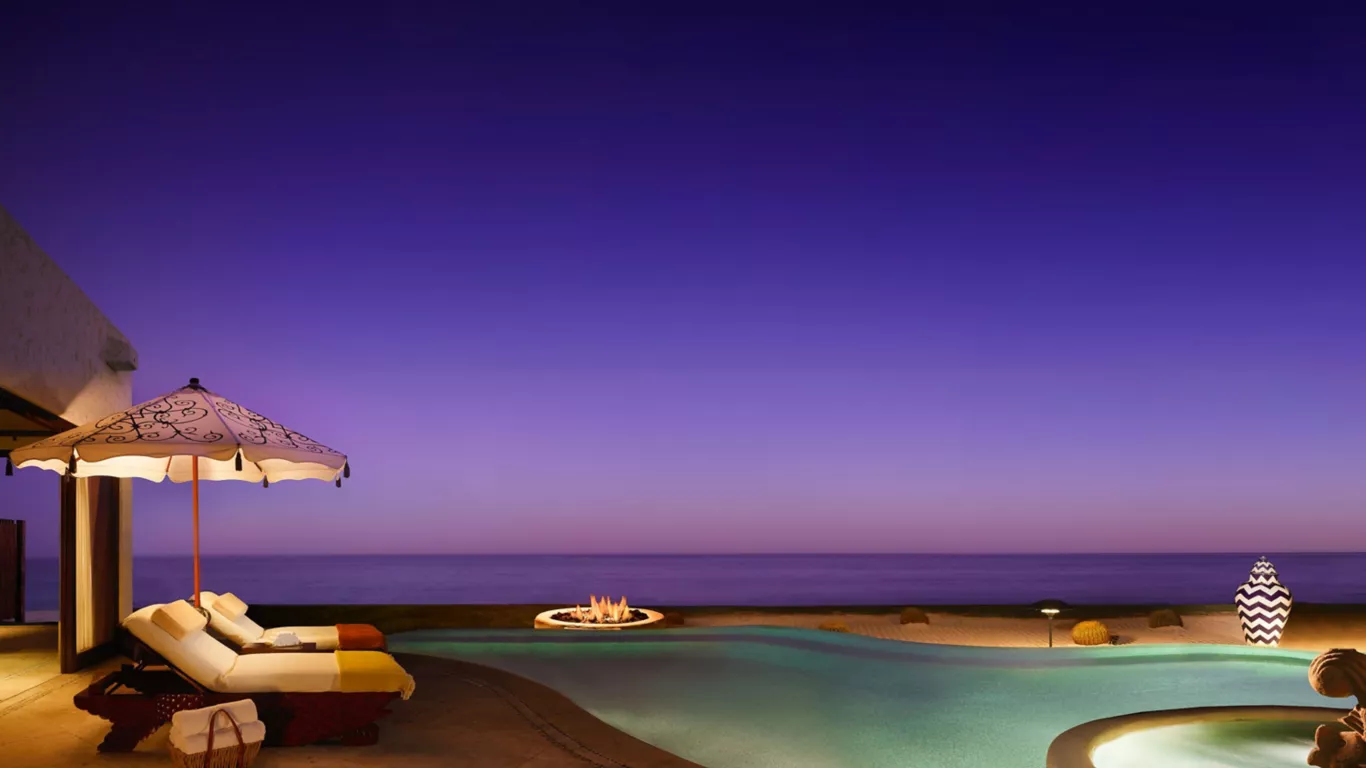 Luxury resort infinity pool overlooking the Sea of Cortez at twilight — HauteBlack wine and wellness Mexico