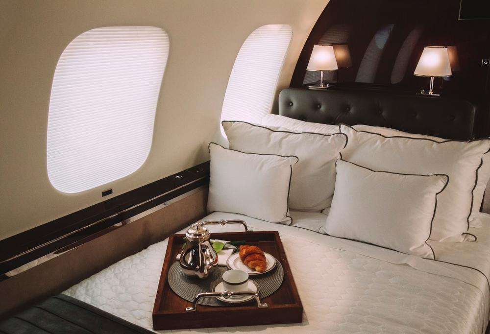 Luxury private jet interior with champagne service