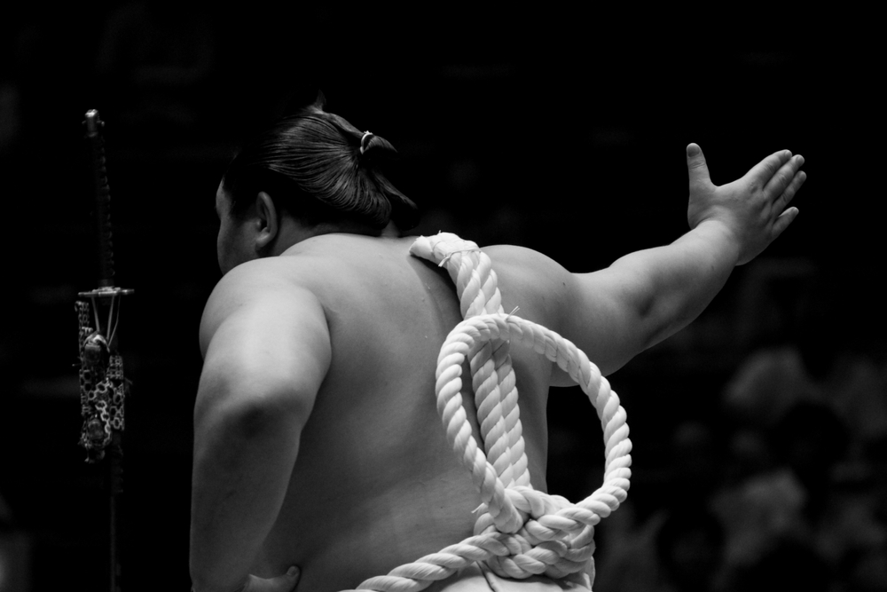 Grand Sumo tournament at Ryogoku Kokugikan Tokyo — wrestlers performing ritual ceremony in the sacred ring