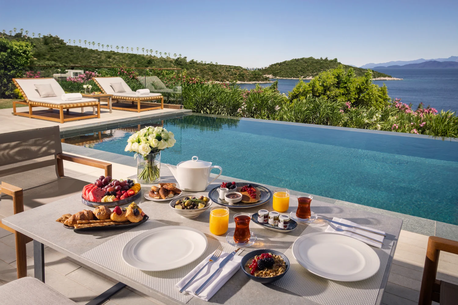Aerial view of Bodrum whitewashed town and turquoise Aegean coastline, Turkey — HauteBlack coast and culture